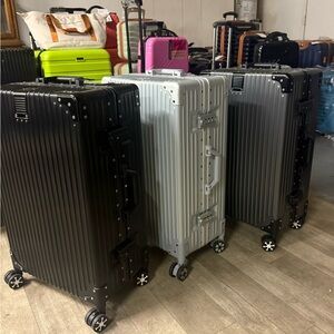 Aluminum frame Hard Shell Suitcases in Black, Silver, and Gray